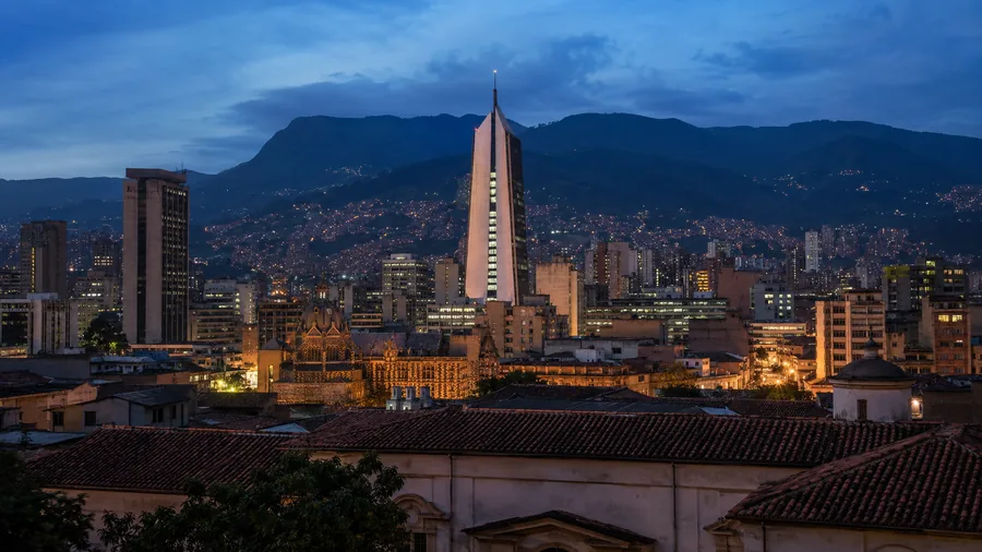 Medellín's El Centro skyline at blue hour with the Coltejer building and Rafael Uribe Uribe Palace